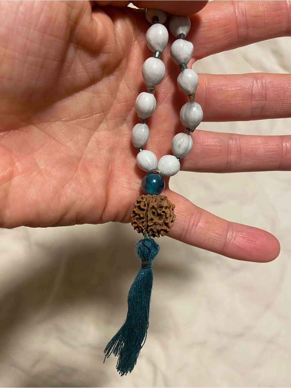 Handmade White Job’s Tears Mala with Teal Tassel with Rudraksha Guru bead
